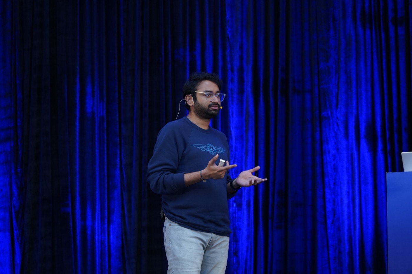 On stage delivering a technical talk